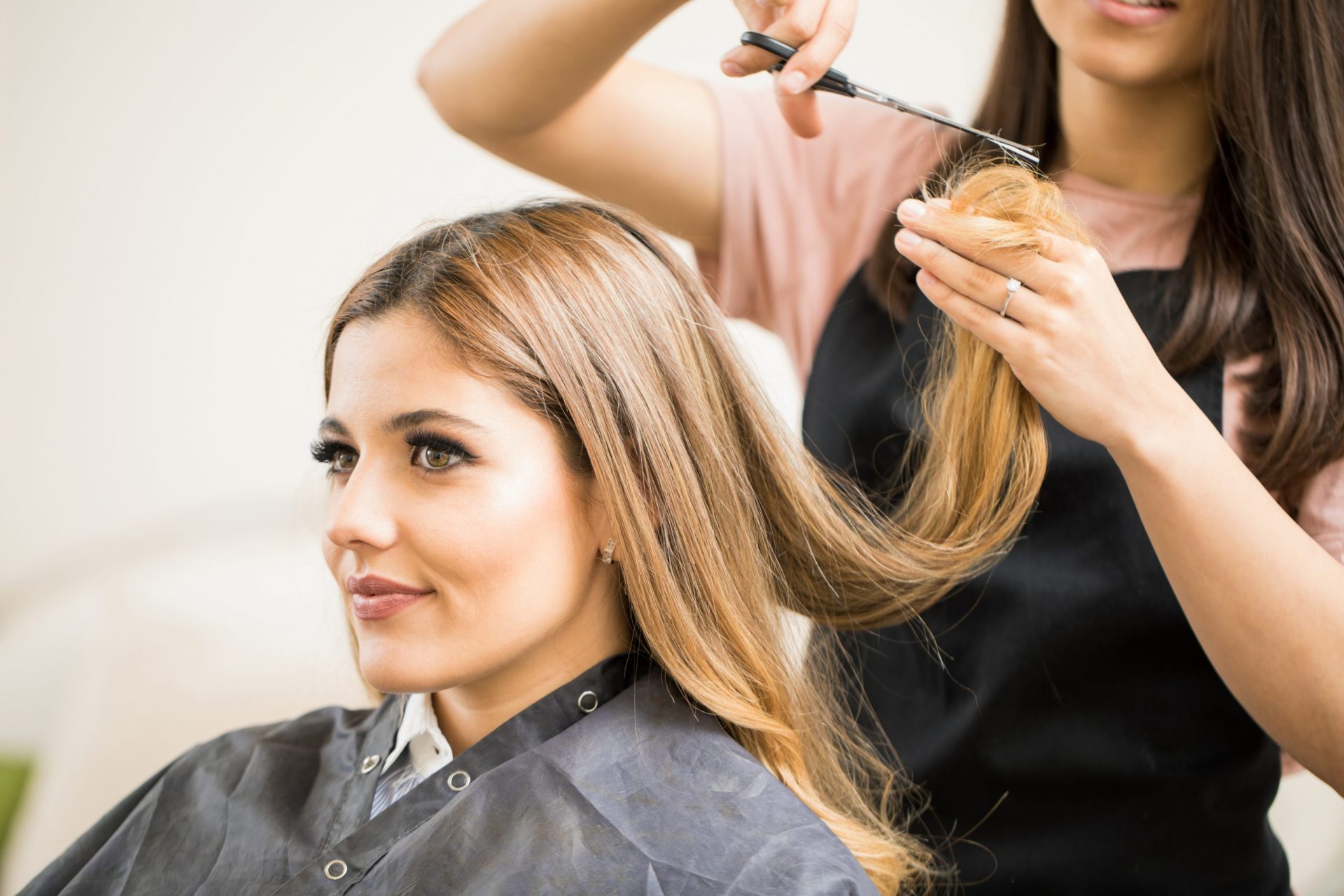 Woman Cutting hair in Beauty Salon