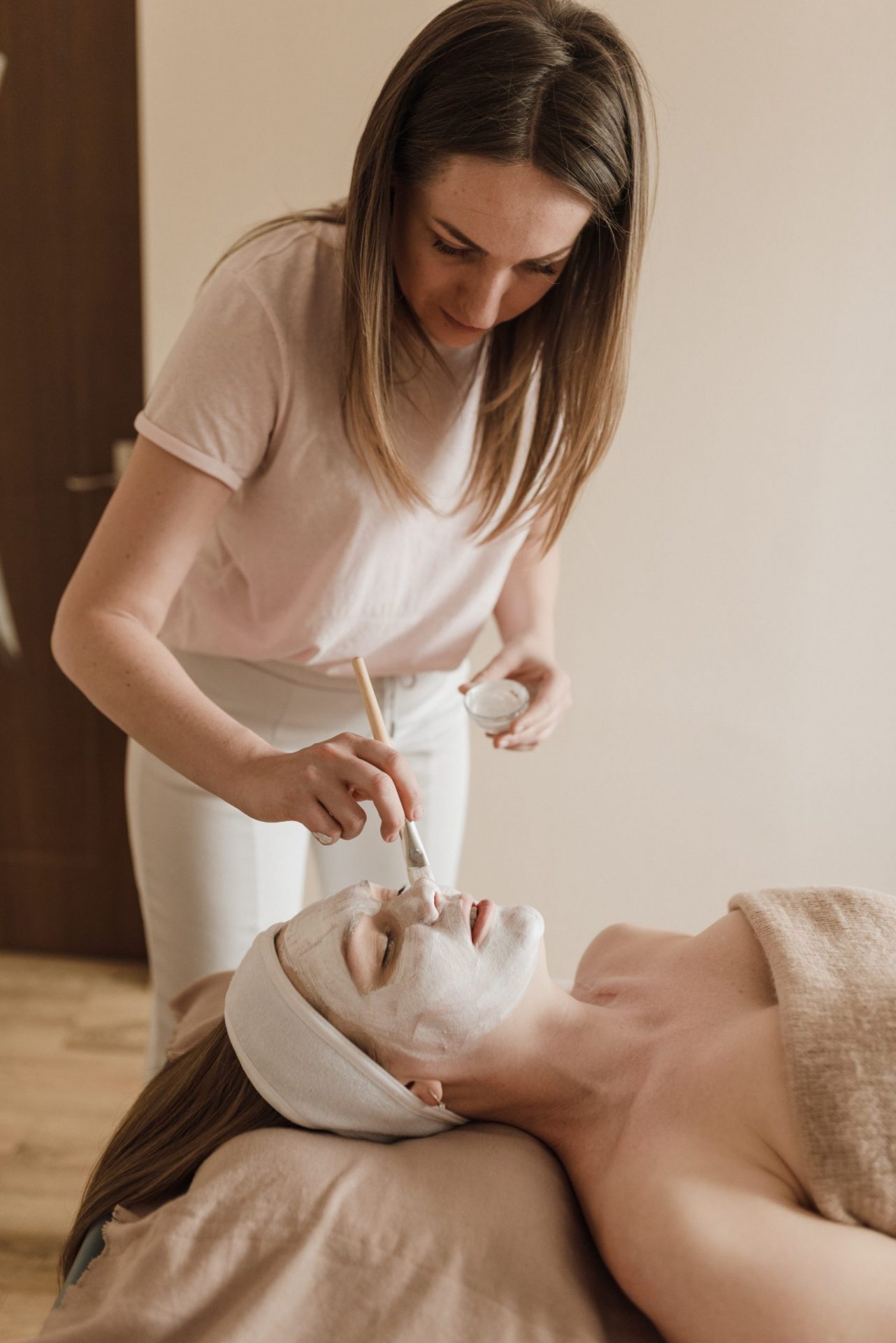 Woman recieiving a facial skin care treatment Chop Shop Beauty Salon